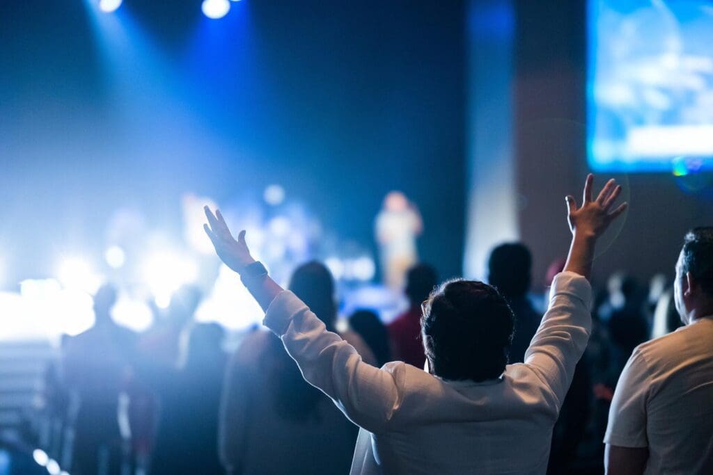 Corporate event, person enjoying with open hands